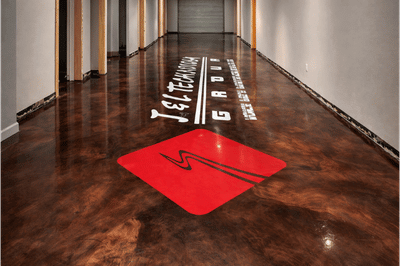 metallic epoxy floor with logo installed altus ok luxe