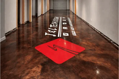 metallic epoxy floor with logo installed altus ok luxe