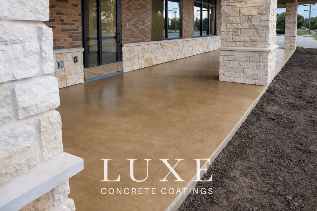 outdoor commercial patio light tan stained concrete installed by Luxe Concrete Coatings
